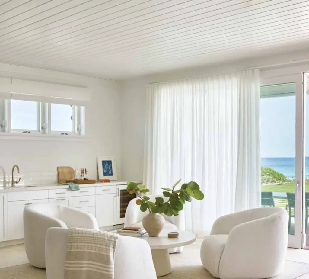 custom automated sheer drapes diffusing sunlight to protect interior furniture from UV rays